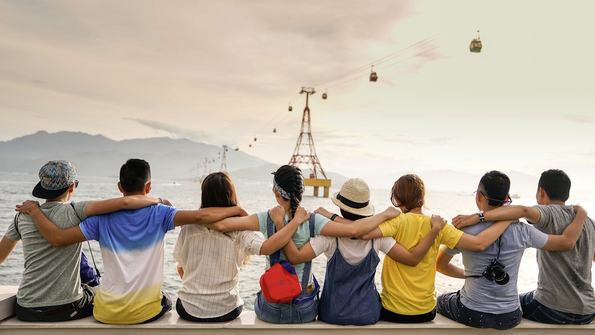 A group of friends laughing together outdoors