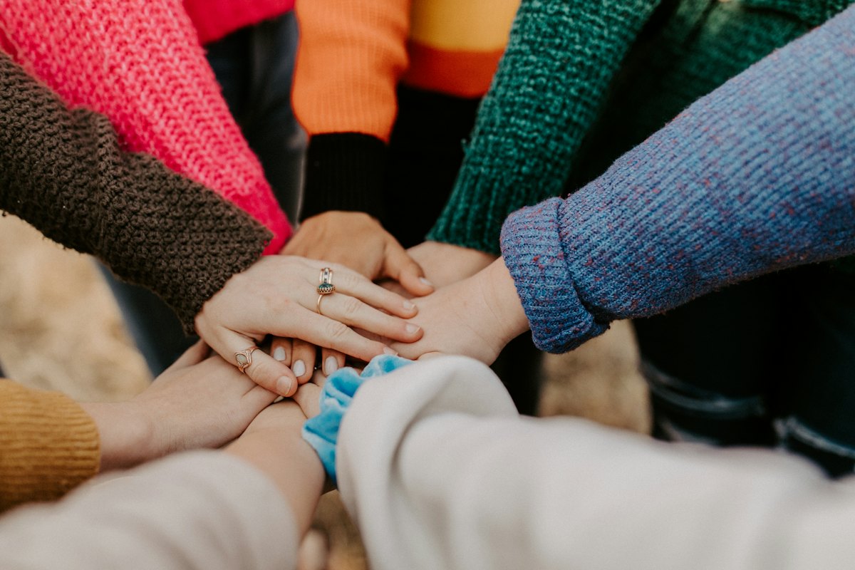 Hands joined together in support